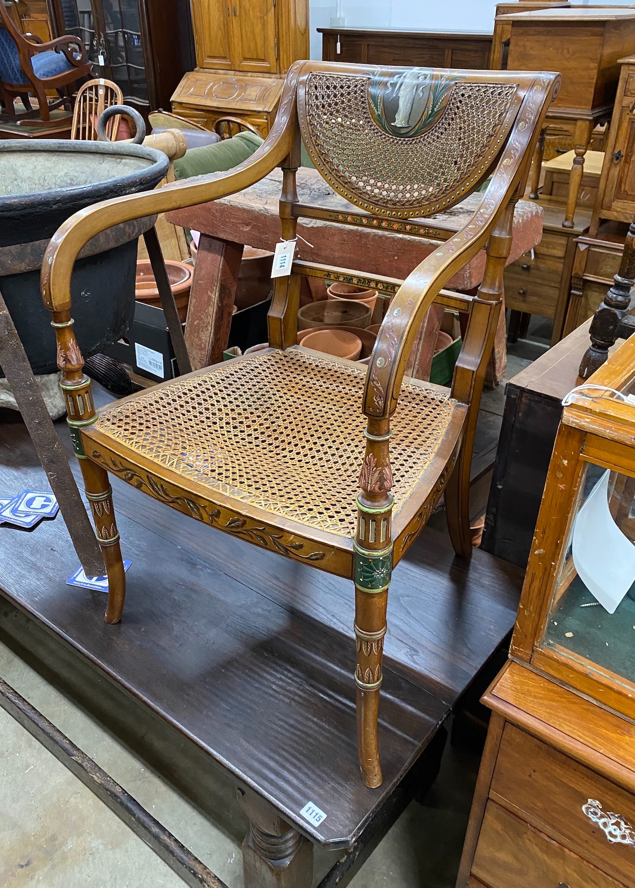 An Edwardian Sheraton Revival painted cane seat elbow chair, width 55cm, depth 48cm, height 86cm